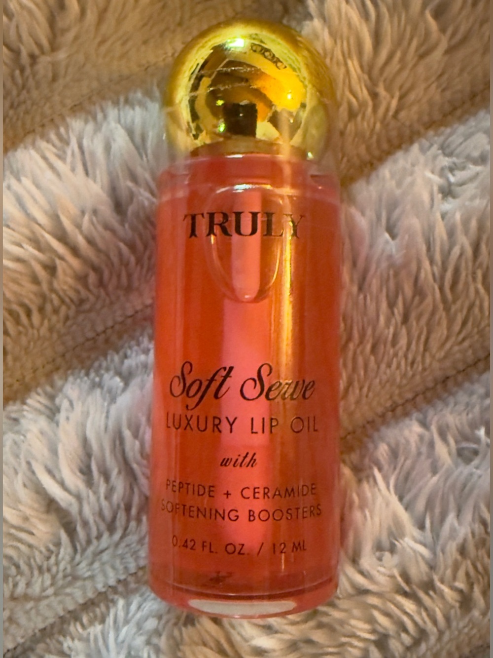 TRULY Soft Serve Luxury Lip Oil in Orange with Gold Cap